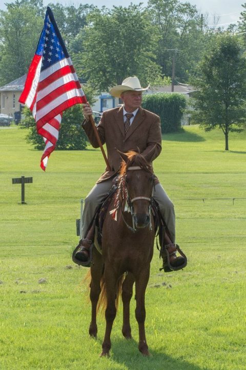 Rider carrying the American flag